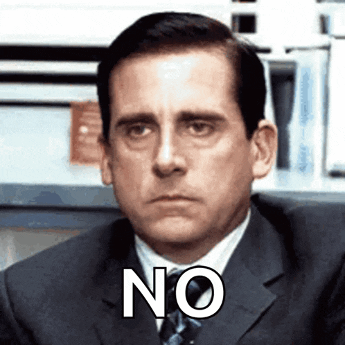 a man in a suit and tie says no on his face
