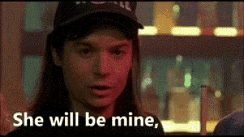 a woman is wearing a hat and the words she will be mine