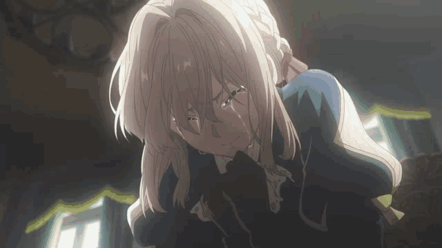 a girl with blonde hair is crying with tears coming down her face