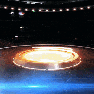 an empty stadium with a large circle in the middle
