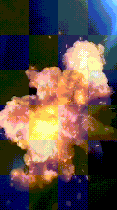 a large explosion with a lot of fire and sparks coming out of it