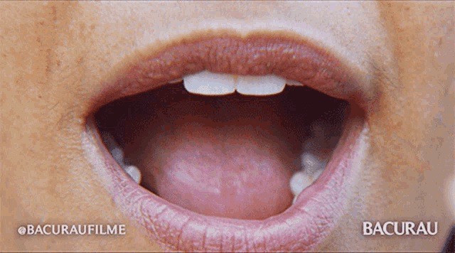 a close up of a woman 's mouth with the words bacurau on the bottom right