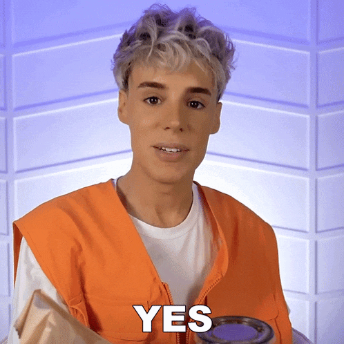 a man wearing an orange vest says yes while holding a cup