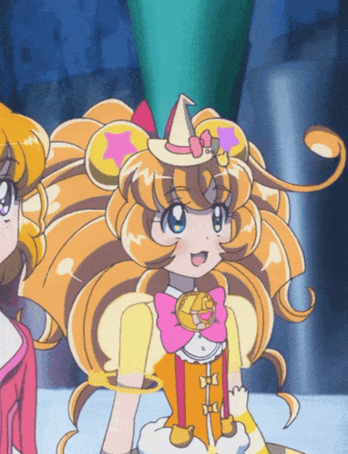 a close up of a cartoon character with a witch hat on her head