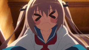 a girl with pigtails is making a face with her eyes closed