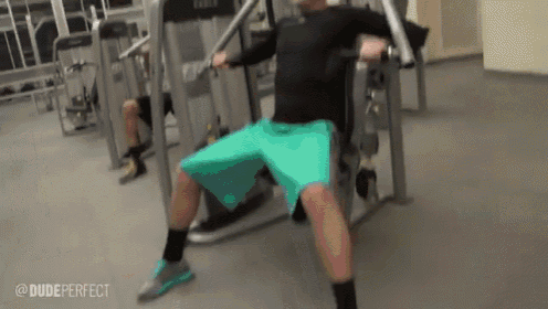 a man is doing exercises on a machine in a gym with the caption dude perfect .