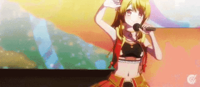 a girl is singing into a microphone while standing on a stage .