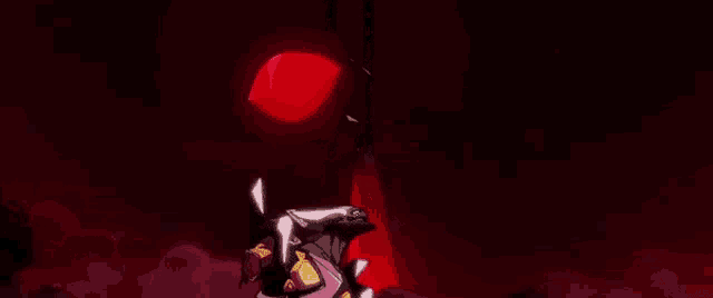 a cartoon character is standing in front of a large red object in the dark .