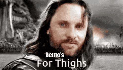 a man with a beard and long hair is standing in a field with a sword .
