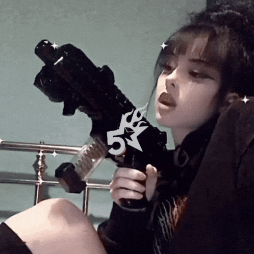 a girl holding a gun with a 5 on it
