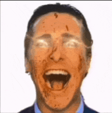 a close up of a man 's face with blood on it