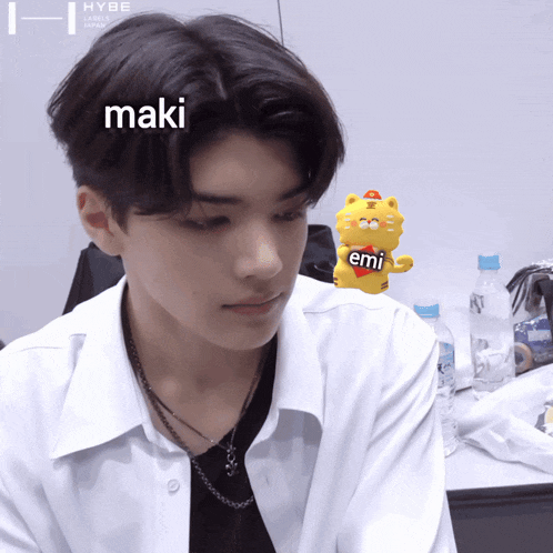 a young man with the name maki on his face