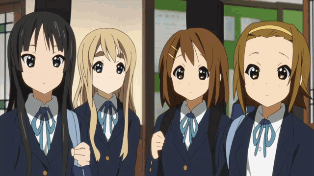 a group of anime girls standing next to each other with their eyes closed
