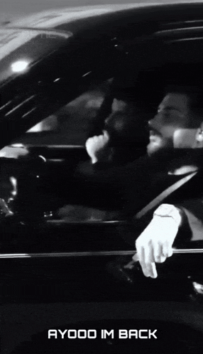 a black and white photo of a car with the words ayooo im back on the bottom right