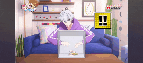 a man in a purple hoodie is playing a video game on a blue couch
