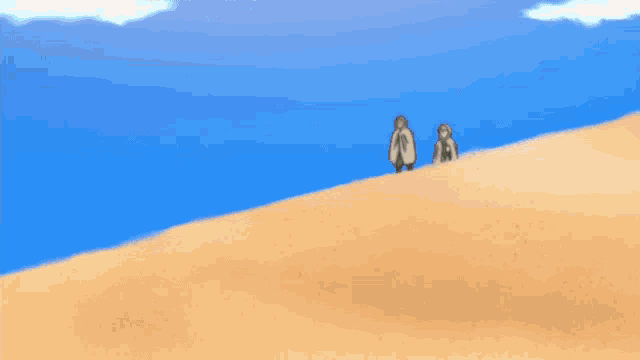 a person in a white cape is jumping over a sand dune