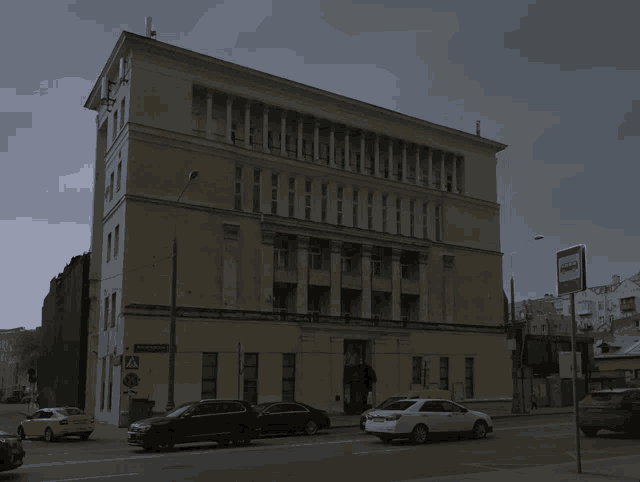 a large building with a blue sign that says " bus " on it