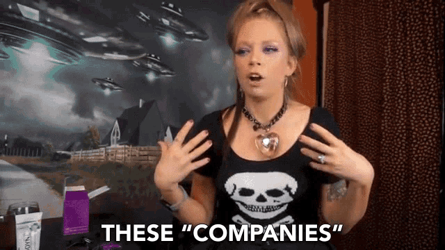 a woman in a skull shirt says " these companies "