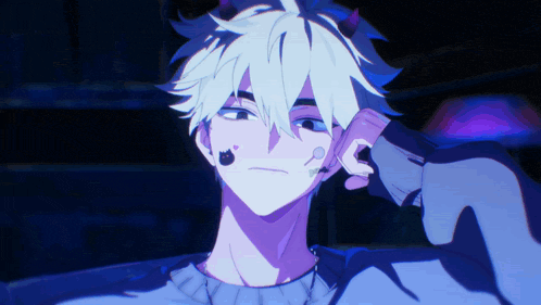 a boy with horns on his head is wearing a blue sweater and a black cat earring