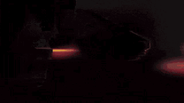 a skull with a red light in the background