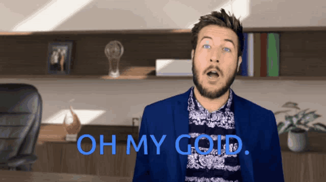 a man in a blue suit says oh my goid