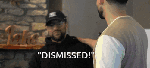 a man talking to another man with the words " dismissed " written on the bottom