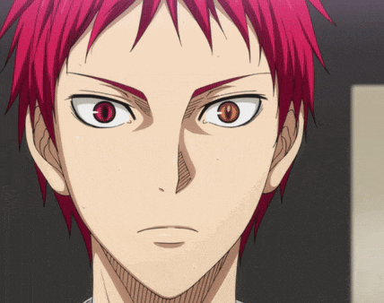 a close up of a person with red hair and red eyes