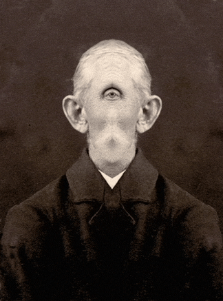 a man with one eye and a beard is wearing a black jacket