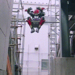 a person is flying through the air while wearing a robot costume