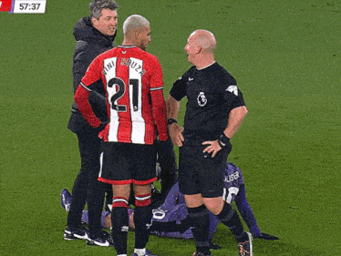 a soccer player with the number 21 on his shirt