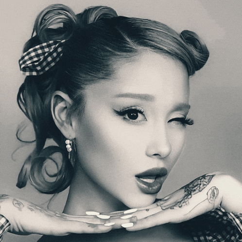 a black and white photo of a woman 's face
