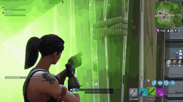 a woman is playing a video game called fortnite with a green screen behind her