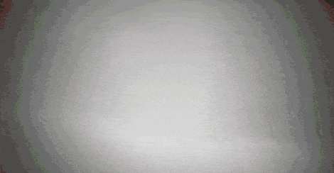 a gray background with a few dots on it