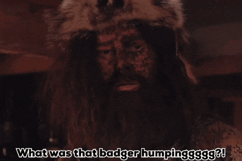 a man with a beard wearing a fur coat says what was that badger humpingggg