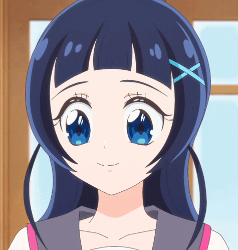 a girl with blue eyes and a blue x in her hair
