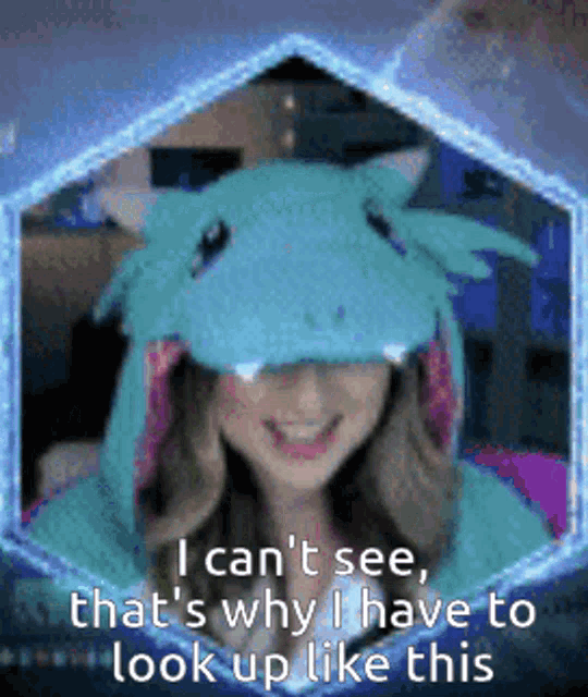a woman is wearing a unicorn costume and says i can 't see