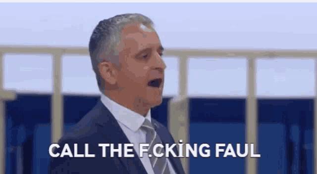 a man in a suit and tie is screaming and saying `` call the f.cking faul '' .