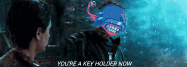 a man talking to another man with the words you 're a key holder now on the bottom