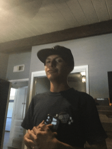 a young man wearing a hat and a shirt that says ' santa cruz '
