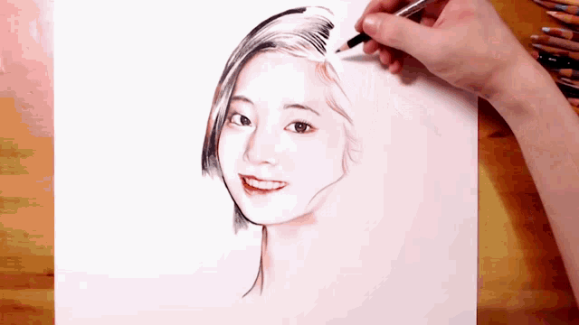 a person is drawing a portrait of a woman with colored pencils