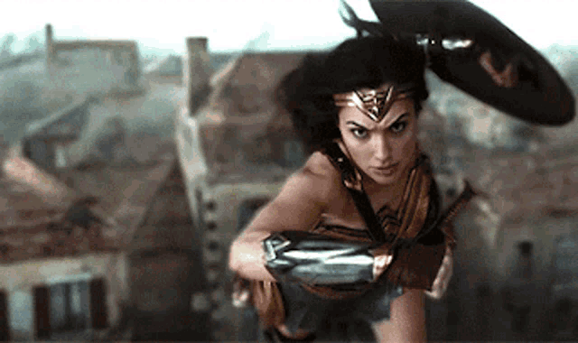 a woman in a wonder woman costume flying through the air