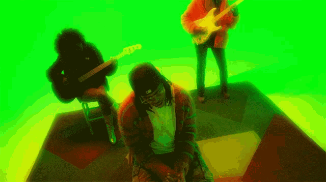 a man playing a guitar and another man playing a bass
