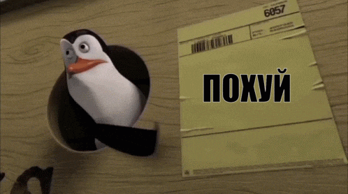 a penguin is standing next to a piece of paper that says poxury