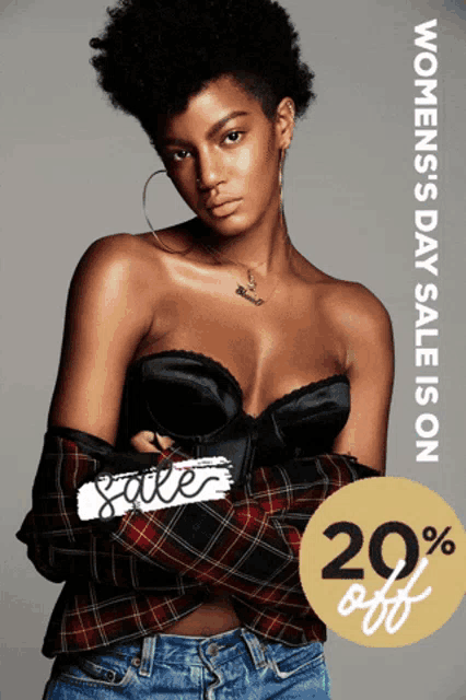 a woman is standing in front of a sign that says women 's day sale