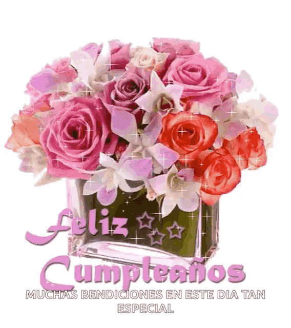 a bouquet of pink roses in a vase with the words feliz cumpleanos written on it