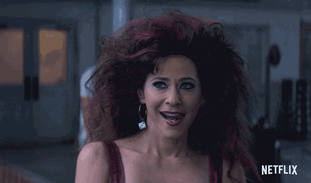 a woman with pink hair and a netflix logo in the corner