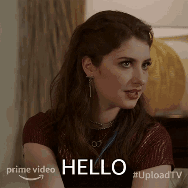 a woman is sitting on a couch and says hello on the bottom
