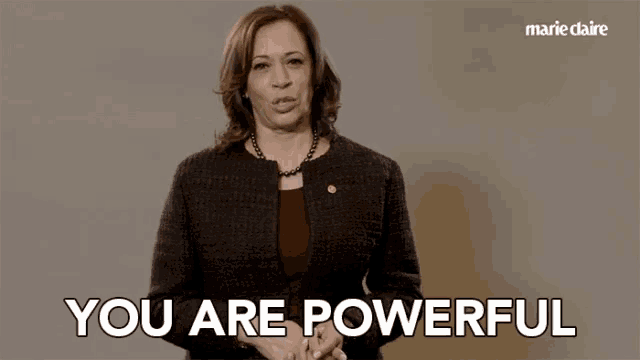 a woman says you are powerful in front of a marie claire ad
