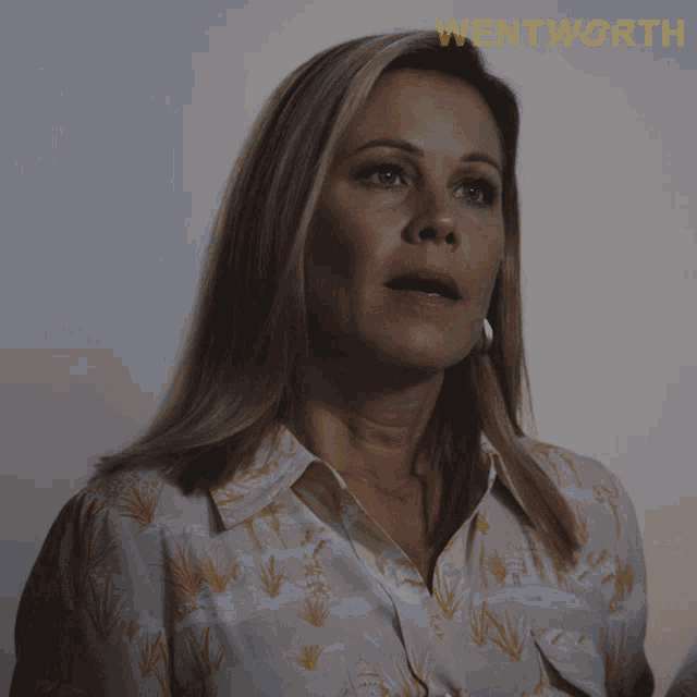 a close up of a woman 's face with the word wentworth on the bottom right