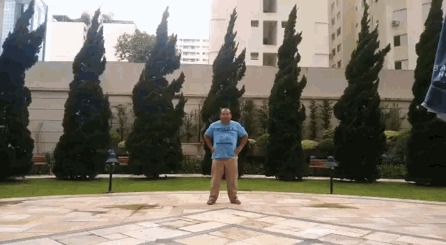 a man wearing a blue shirt that says ' rio de janeiro ' on the front